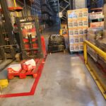 Présence de palettes / matériel dans une zone de circulation ou de manœuvre.